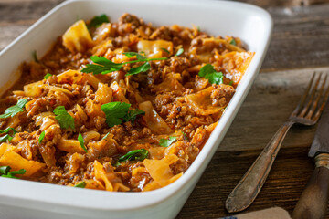 Wall Mural - minced meat with cabbage in a white casserole 