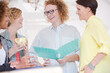© KOTO - Portrait of female colleagues smiling in office