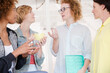 © KOTO - Women with coffe cup smiling in office