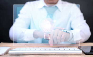 Poster - Idea innovation and inspiration concept. businessman holding illuminated light bulb, Hands holding light bulb for Concept new idea concept 
