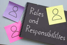 Roles And Responsibilities Are Shown On The Conceptual Photo Using The Text