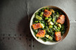 Healthy salmon bowl with avocado spinach and edamame beans