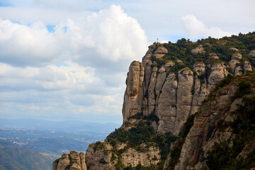 Montserrat is a mountain near Barcelona, in Catalonia. It is the site of a Benedictine abbey, Santa Maria de Montserrat, which hosts the Virgin of Montserrat sanctuary