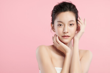 Beautiful young asian woman with clean fresh skin on pink background, Face care, Facial treatment, Cosmetology, beauty and spa, Asian women portrait.