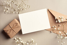 Invitation Or Greeting Card Mockup With Gift Box And Gypsophila Plant Twigs