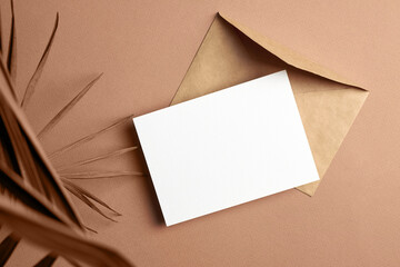 Greeting or invitation card mockup with palm tree leaf decorations