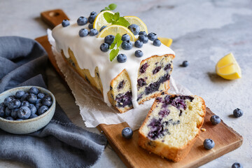 Wall Mural - Lemon blueberry loaf of bread cake with sugar glaze