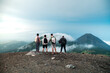 friends hiking with the izalco volcano at the background, el salvador