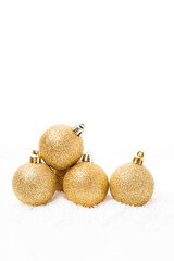 Wall Mural - Christmas golden balls for Christmas tree decoration on white background, Christmas toys,  copy space