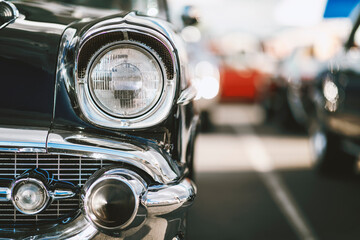 Wall Mural - Classic car show, close-up on vehicle headlights, vintage color