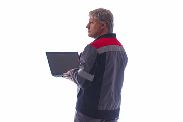 Poster - Computer engineer on a light background. He works with a laptop in his hands. Computer engineer in gray work uniform. Concept - advertising computer engineer. Electronics repair services