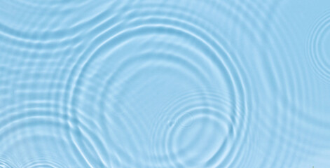 water panoramic banner background. white aqua texture, surface of ripples, rings, transparen and sun