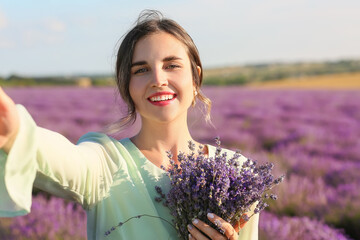 Sticker - Beautiful young woman taking selfie in lavender field