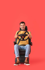 Sticker - Angry man in car seat and with steering wheel on color background