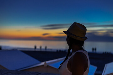 Wall Mural - person watching sunset