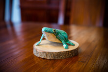Fake Frog Made Of Wood On A Table