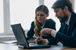© SHOTPRIME STUDIO - managers sitting in front of a laptop teamwork officials