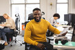 © Wavebreak Media - Portrait of smiling african american male creative at work, sitting at desk, looking to camera