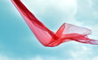 Leinwandbild Motiv Rotes Seidentuch flottert m Wind