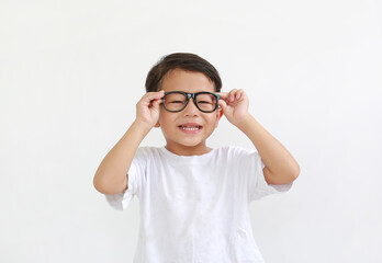 Smiling asian little boy child wearing glasses isolated on white background