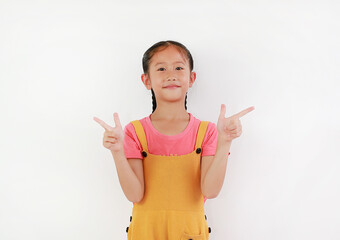 Wall Mural - Asian little girl child gesture finger pointing at beside against white background