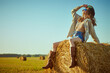hippie girl on a haystack