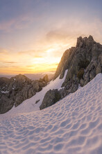 Landscape Of Snowy Mountains At Sunset
