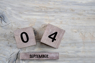 Wall Mural - cube calendar for september on wooden background with copy space