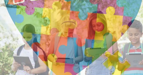 Poster - Animation of colourful puzzle pieces and heart over kids friends using electronic devices