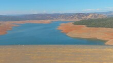 2021- Aerial Of Oroville Dam In California Reveals Extreme Drought Conditions During A Major Water Crisis.