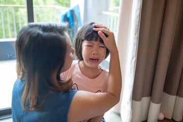 Wall Mural - mother hit her kid, children crying, feeling sad, young girl unhappy, family violence concept, selective focus and soft focus