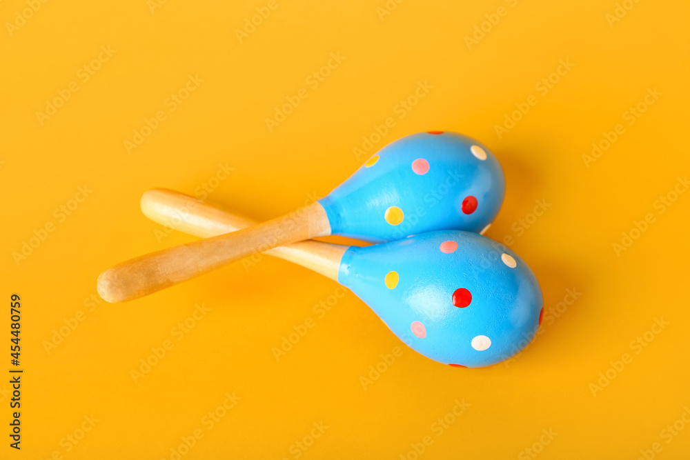 Mexican maracas on color background