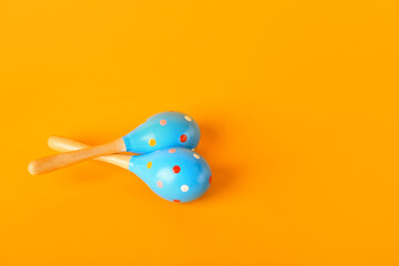 Mexican maracas on color background