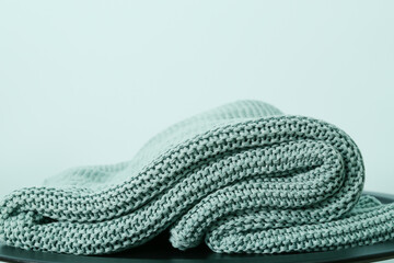 Wall Mural - Knitted plaid on color background, closeup