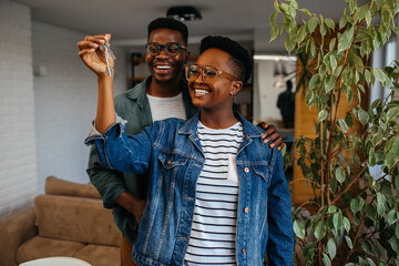 Happy black couple in their new apartment