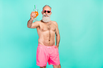 Sticker - Photo of tourist businessman drink orange cocktail say toast wear sunglass isolated turquoise color background