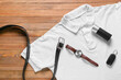 © Pixel-Shot - Set of male accessories and stylish t-shirt on wooden background