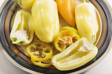 Wall Mural - sweet yellow pepper on a clay plate