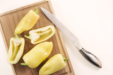 Wall Mural - sweet yellow pepper on a wooden board