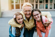 © hedgehog94 - Happy grandmother came to pick upher granddaughters from school.