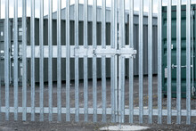 Security Gate Entrance Locked With A Padlock And Sliding Bolt