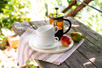 Wall Mural - Breakfast serving for two, tea cups and fruits