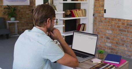 Poster - Caucasian man sitting at desk watching coding data processing on laptop screen