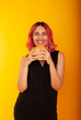 © Marina Chernivetskay - a girl holds unhealthy fast food in her hands looking into the frame