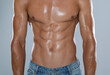 © New Africa - Shirtless man with slim body on grey background, closeup