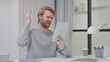 Disappointed Beard Redhead Man having Loss on Tablet 