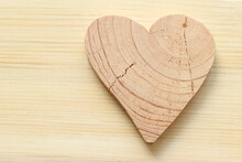 Wooden Hearts On A Light Background. Wooden Hearts Carved From Wood. Painted Wood Background. 