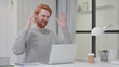 Beard Redhead Man Reacting to Loss While on Laptop 