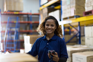 Wall Mural - Portrait of warehouse female worker in the warehouse storage with happy and smile. Inspection quality control