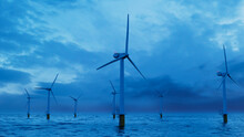 Wind Power. Offshore Wind Turbines At Dusk. Sustainable Power Concept.